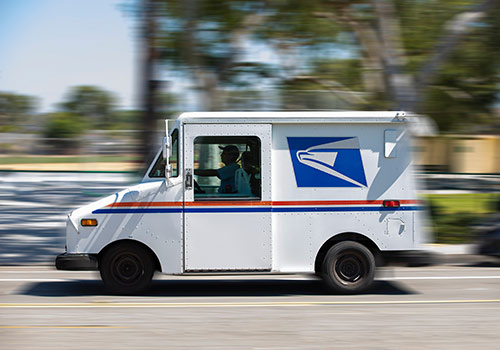 Usps Mail Truck Leaves For A Delivery 