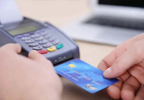Man using chip reader for credit card payment