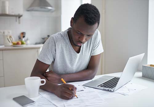 Young man sending certified mail online