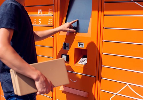 Someone using a parcel locker