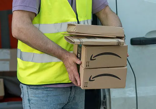 An Amazon worker delivering packages.